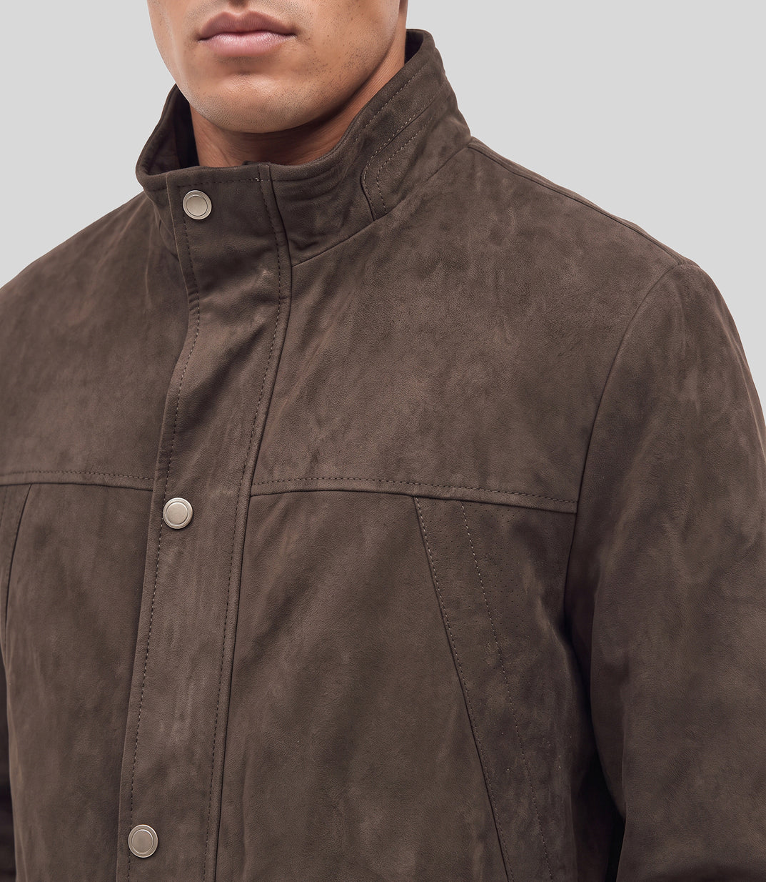 Suede Long Jacket in brown, close-up of the stand collar and snap buttons