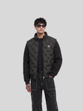 Convertible Quilted Jacket in black, front view on model with sleeves on