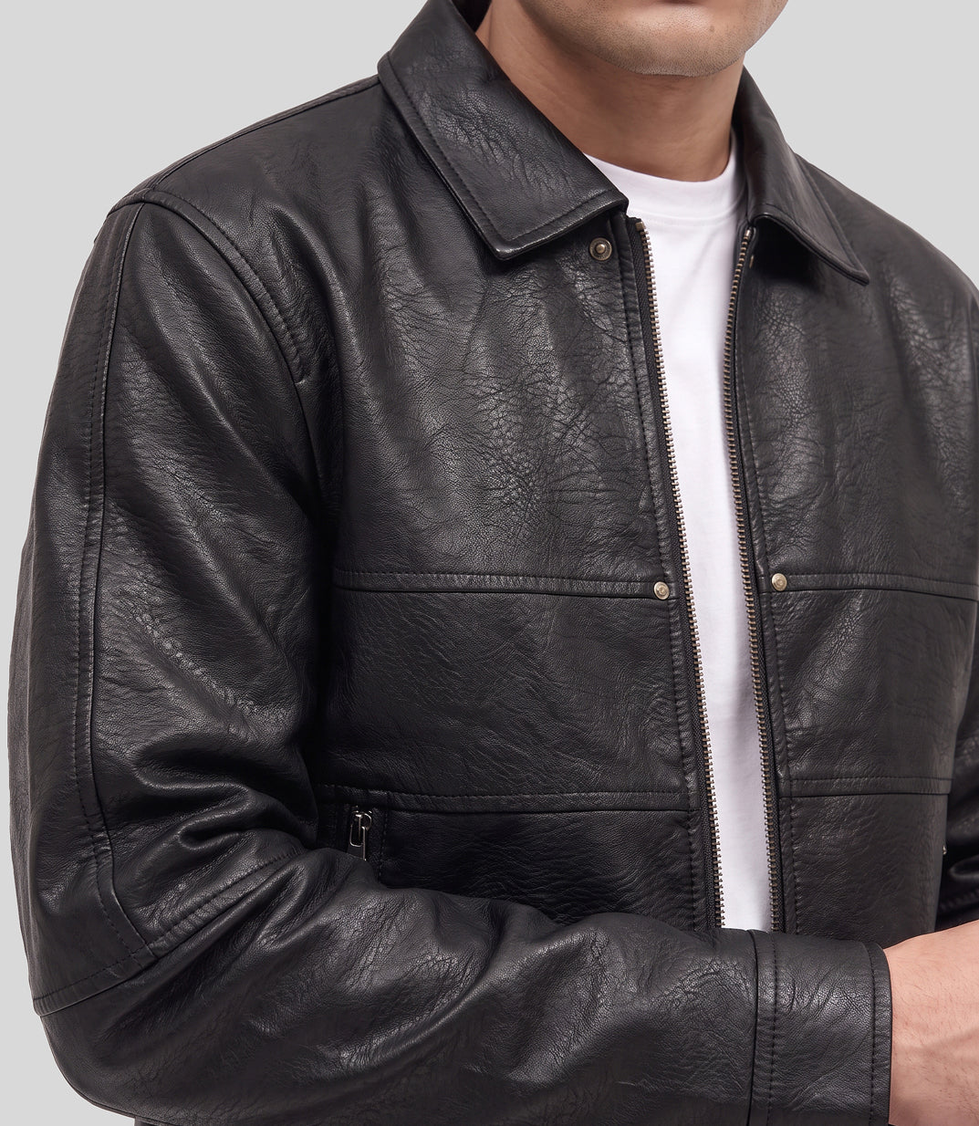 Panelled Leather Jacket in black, close-up of the shirt collar and chest panels