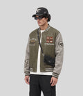 Varsity Bomber Jacket in olive, front view on model