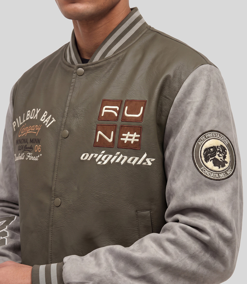 Varsity Bomber Jacket in olive, close-up of the embroidered patches